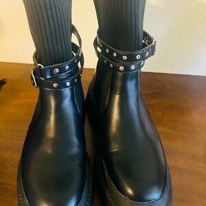 Women’s black faux leather chunky platform boots.